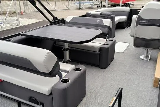 Slide: The Image of 2026 Viaggio x22u boat interior with modern seating and table setup. - 11