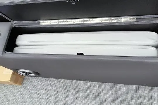 Slide: The Image of Storage compartment in a 2026 Viaggio x22u, featuring sleek design and light upholstery. - 12