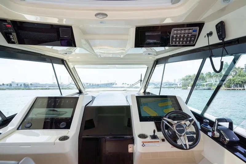 Slide: The Image of Cockpit view of 2020 Scout 530 LXF yacht with advanced navigation systems. - 100