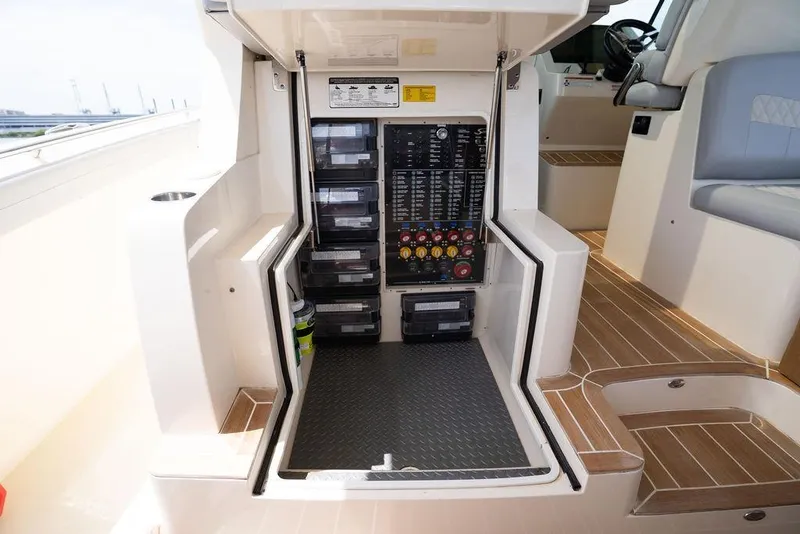 Slide: The Image of Electrical panel inside 2020 Scout 530 LXF boat, featuring organized switches and controls. - 102