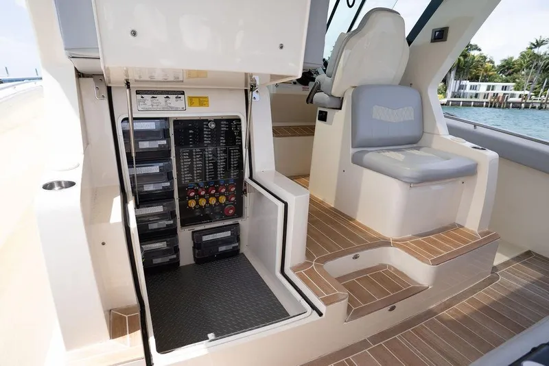 Slide: The Image of Interior view of 2020 Scout 530 LXF boat showing control panel and seating area. - 104