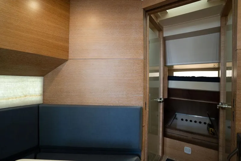 Slide: The Image of Luxurious interior of 2020 Scout 530 LXF yacht with modern wood finish and cozy seating. - 108