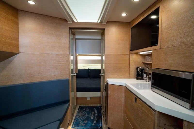 Slide: The Image of Luxurious interior of 2020 Scout 530 LXF yacht with modern kitchen and cozy seating area. - 109