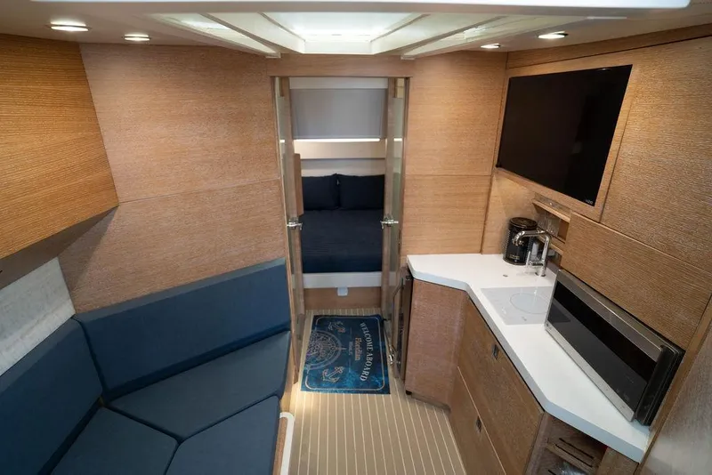 Slide: The Image of Luxurious interior of 2020 Scout 530 LXF yacht with modern amenities and cozy seating. - 111