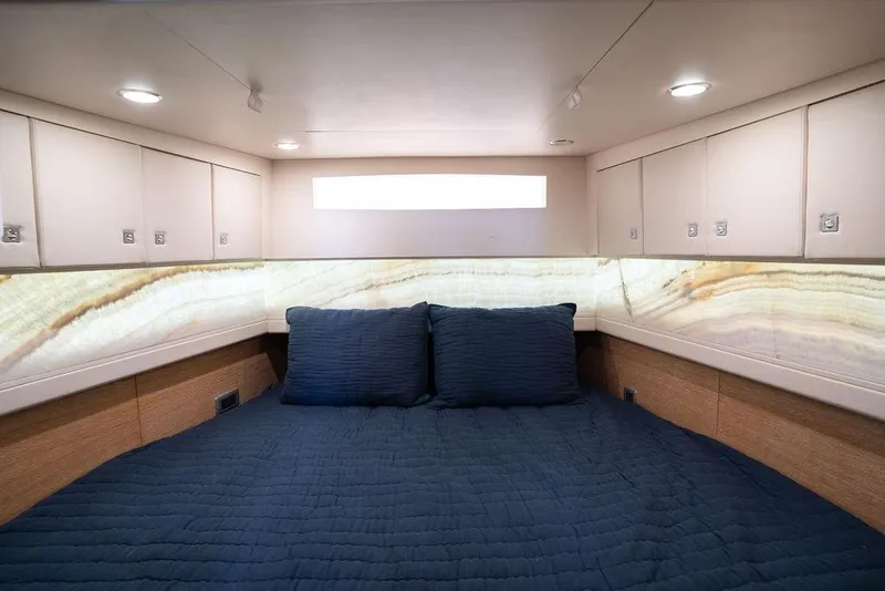 Slide: The Image of Luxurious cabin interior of 2020 Scout 530 LXF with elegant bedding and ambient lighting. - 113