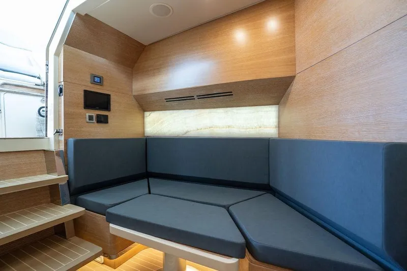 Slide: The Image of Luxurious interior seating area of 2020 Scout 530 LXF yacht with modern design. - 115
