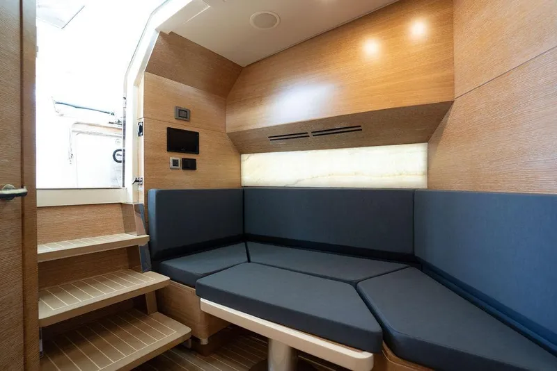 Slide: The Image of Luxurious interior of 2020 Scout 530 LXF yacht with modern seating and wooden accents. - 116