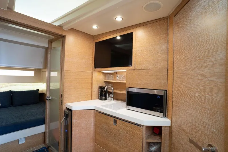 Slide: The Image of Luxurious interior of 2020 Scout 530 LXF yacht with kitchenette and bedroom. - 119