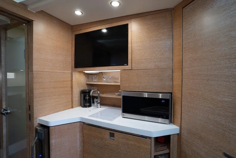 Slide: The Image of Modern kitchen area in 2020 Scout 530 LXF yacht with TV and microwave. - 120