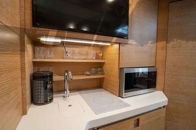 Slide: The Image of Modern kitchen area in 2020 Scout 530 LXF yacht with microwave and sink. - 122