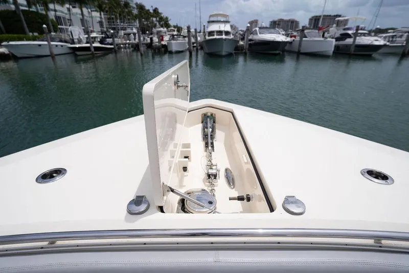 Slide: The Image of 2020 Scout 530 LXF yacht bow with open anchor hatch in marina. - 137