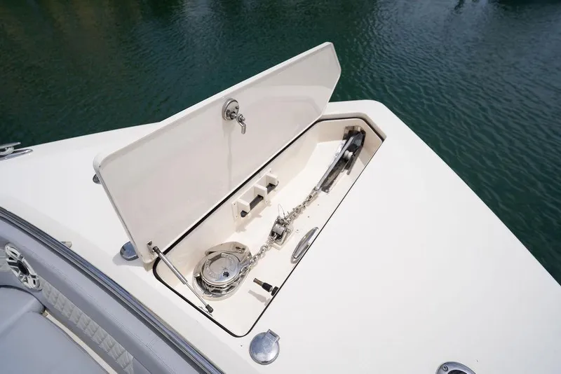 Slide: The Image of Open anchor compartment on 2020 Scout 530 LXF boat, showcasing marine equipment. - 138