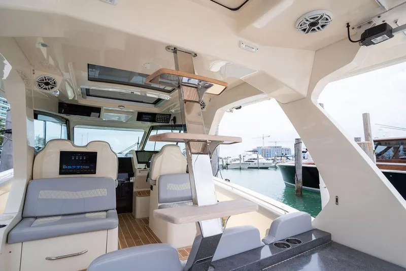 Slide: The Image of Interior view of a 2020 Scout 530 LXF luxury boat docked at a marina. - 140