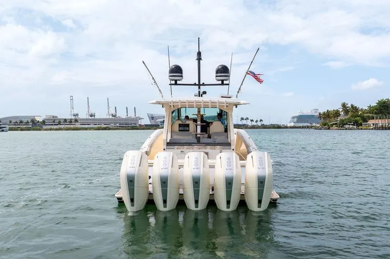 Slide: The Image of 2020 Scout 530 LXF boat with five outboard engines on the water. - 19