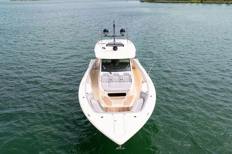 Slide: The Image of 2020 Scout 530 LXF luxury yacht on calm water, aerial view. - 26
