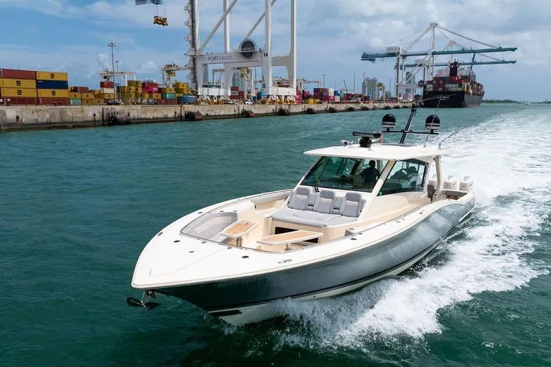 Slide: The Image of 2020 Scout 530 LXF cruising near a busy port with cranes and containers. - 32