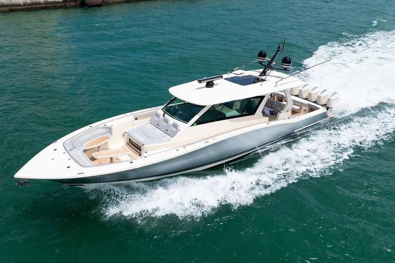 Slide: The Image of 2020 Scout 530 LXF luxury boat cruising on clear blue water. - 35