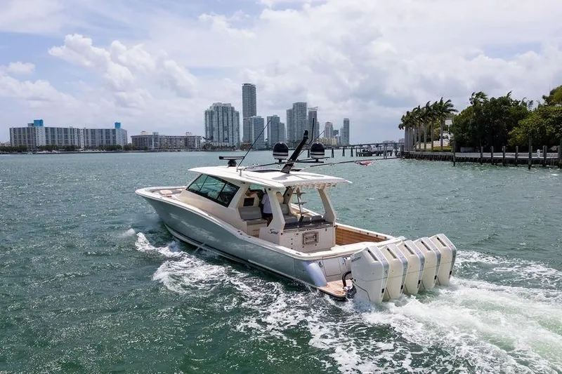 Slide: The Image of 2020 Scout 530 LXF cruising in urban waterfront setting with city skyline. - 38