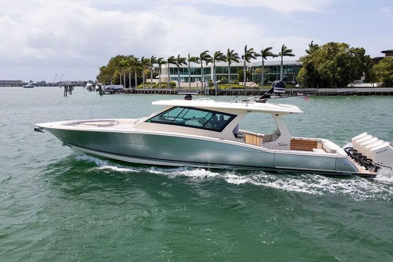 Slide: The Image of 2020 Scout 530 LXF luxury yacht cruising on a scenic waterway. - 40