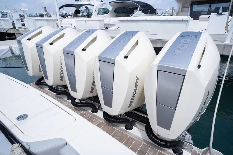 Slide: The Image of Five Mercury 400 outboard engines on a 2020 Scout 530 LXF boat at a marina. - 57