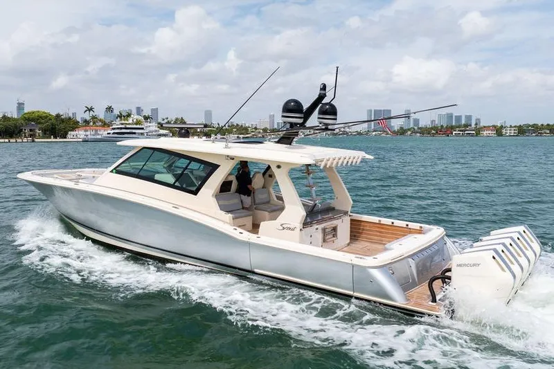 Slide: The Image of 2020 Scout 530 LXF luxury boat cruising on open water. - 6