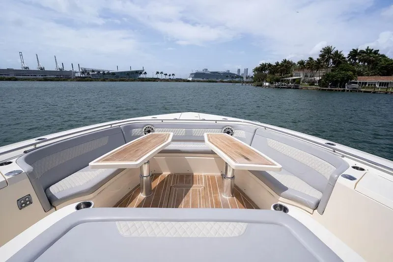 Slide: The Image of Luxurious seating area on 2020 Scout 530 LXF boat with waterfront view. - 60
