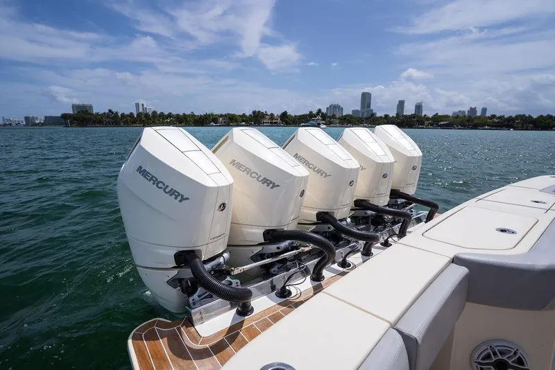 Slide: The Image of 2020 Scout 530 LXF boat with four Mercury outboard engines on the water. - 70