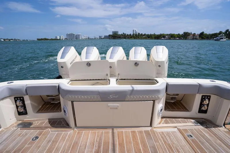 Slide: The Image of 2020 Scout 530 LXF boat with four Mercury outboard engines on a sunny day. - 72