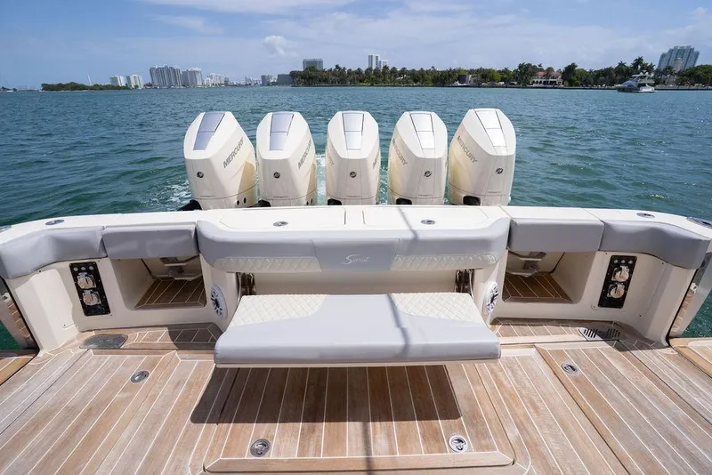 Slide: The Image of 2020 Scout 530 LXF boat with five Mercury outboard engines on a sunny day. - 75