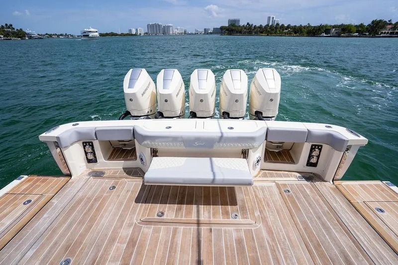 Slide: The Image of 2020 Scout 530 LXF boat with four outboard engines on open water. - 76