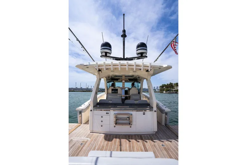 Slide: The Image of 2020 Scout 530 LXF luxury boat docked with spacious deck and modern amenities. - 88