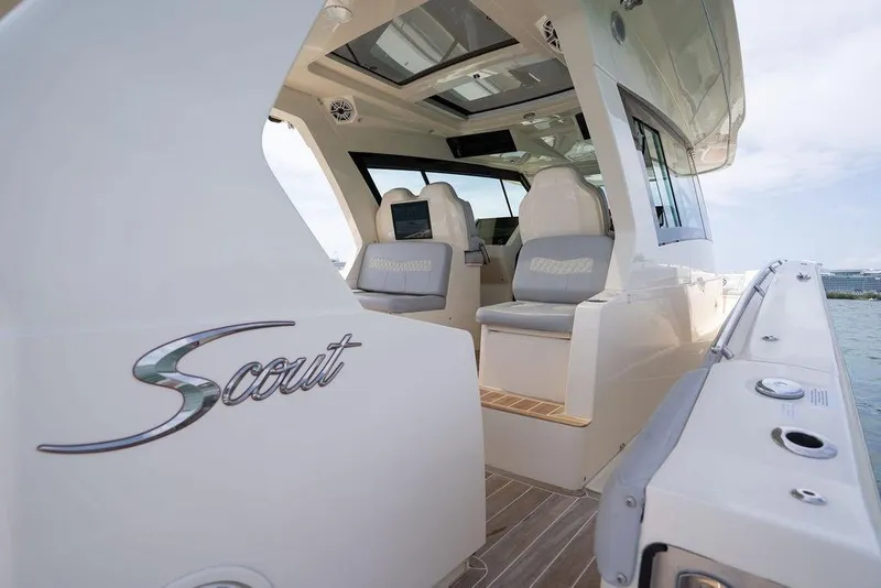 Slide: The Image of 2020 Scout 530 LXF luxury boat interior with seating and sleek design. - 90