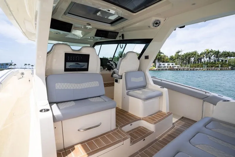 Slide: The Image of Luxurious interior of 2020 Scout 530 LXF yacht with plush seating and scenic water view. - 92