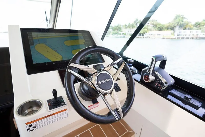 Slide: The Image of Helm of 2020 Scout 530 LXF boat with navigation screen and controls. - 96