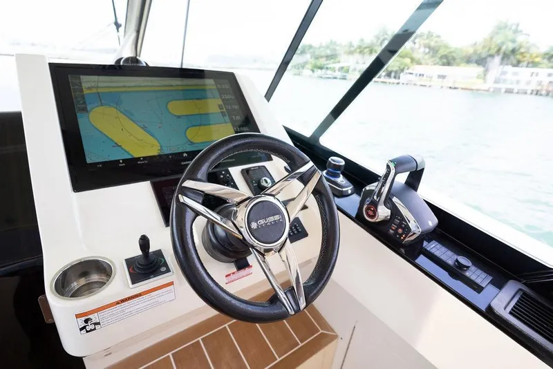 Slide: The Image of Steering console of 2020 Scout 530 LXF boat with navigation display. - 97
