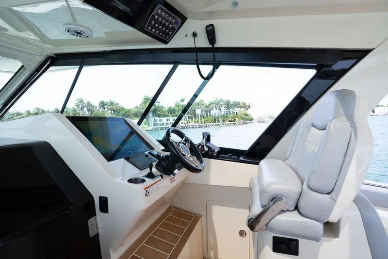 Slide: The Image of 2020 Scout 530 LXF boat helm with modern controls and luxurious seating. - 98