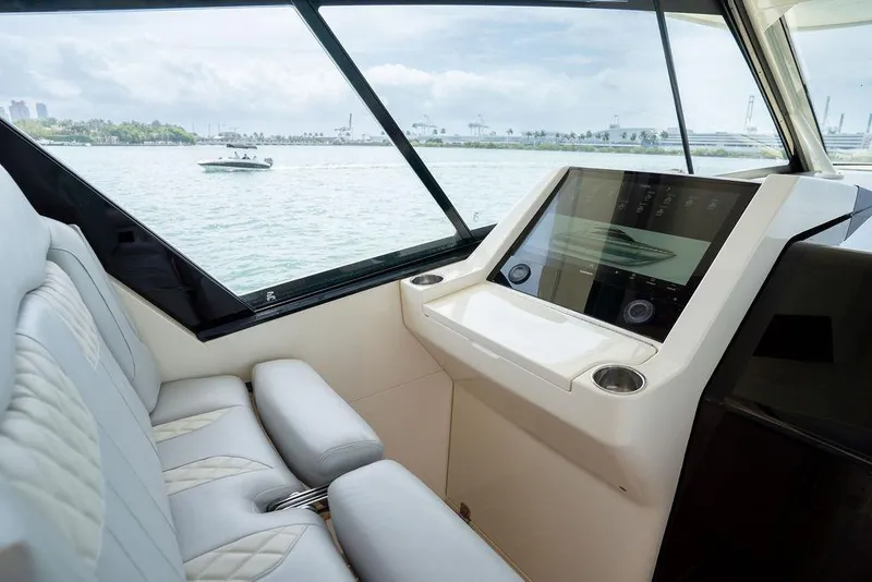 Slide: The Image of Interior view of 2020 Scout 530 LXF yacht with modern dashboard and seating. - 99