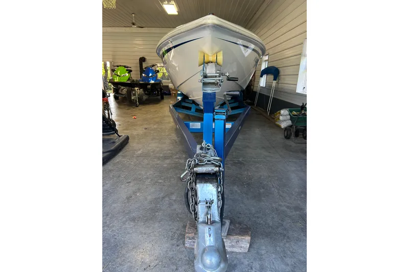 Slide: The Image of 2004 Sunsation 32 Dominator boat on trailer in garage. - 12