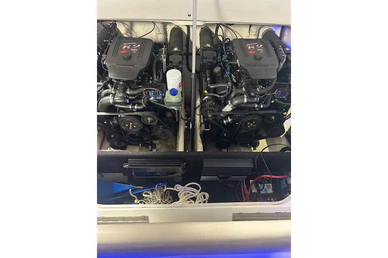 Slide: The Image of Twin engines in a 2004 Sunsation 32 Dominator boat, showcasing powerful performance. - 15