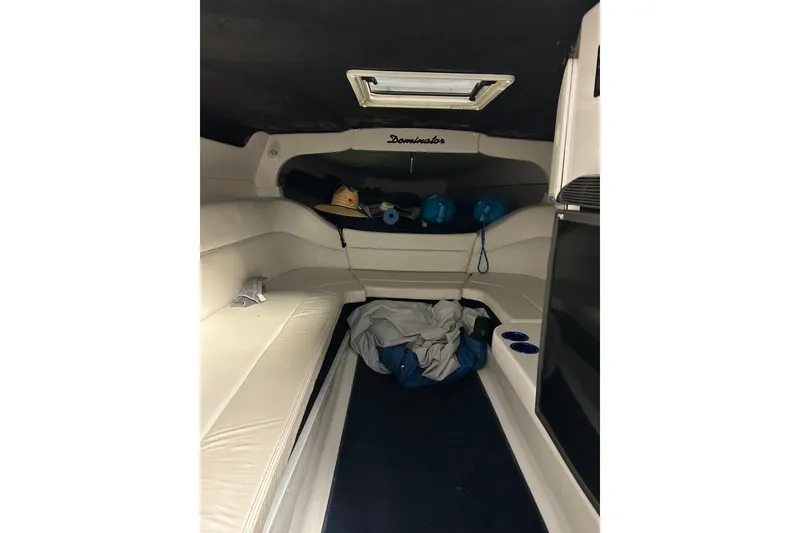 Slide: The Image of Interior cabin of 2004 Sunsation 32 Dominator boat with seating and storage. - 31