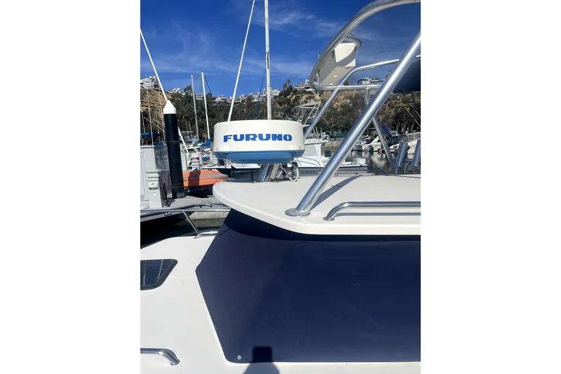 Slide: The Image of 2006 Parker 2520 SL Sport Cabin boat with Furuno radar at marina. - 17