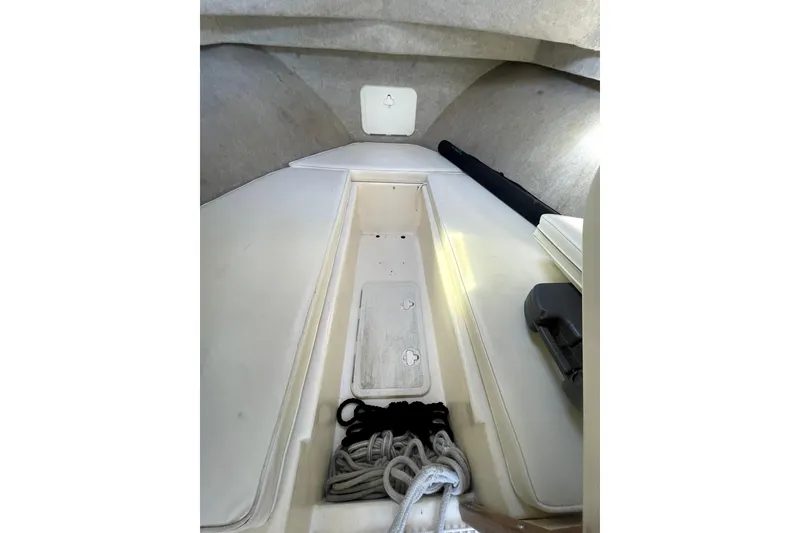 Slide: The Image of Interior cabin view of a 2006 Parker 2520 SL Sport Cabin boat, featuring storage and ropes. - 7