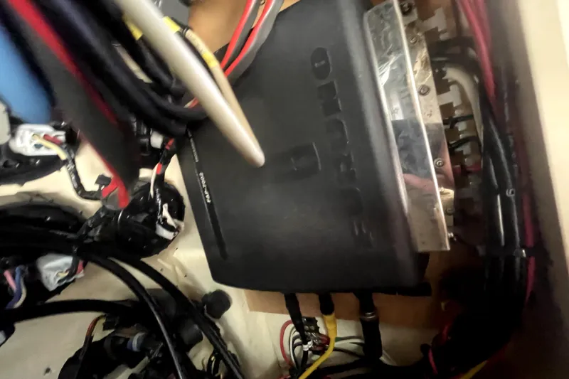 Slide: The Image of Electrical wiring and components inside a 2006 Parker 2520 SL Sport Cabin boat. - 8