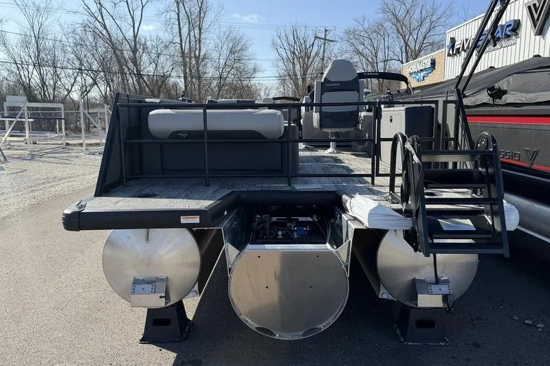 Slide: The Image of 2026 Viaggio X22D pontoon boat with modern design, rear view, parked outdoors. - 3