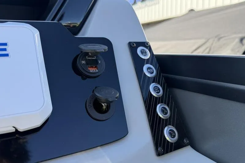 Slide: The Image of Control panel of 2026 Viaggio X22D boat with USB ports and switches. - 5