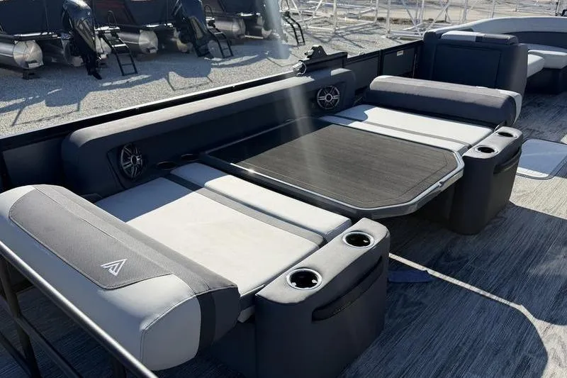 Slide: The Image of Luxurious seating area on 2026 Viaggio X22D boat with cup holders and speakers. - 8