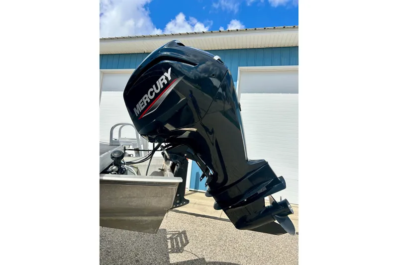 Slide: The Image of Mercury outboard motor on a 2019 Princecraft Vectra 21 boat, parked outdoors. - 10