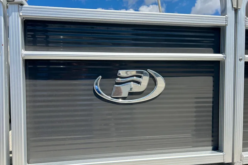 Slide: The Image of 2019 Princecraft Vectra 21 boat logo on metallic panel under blue sky. - 14