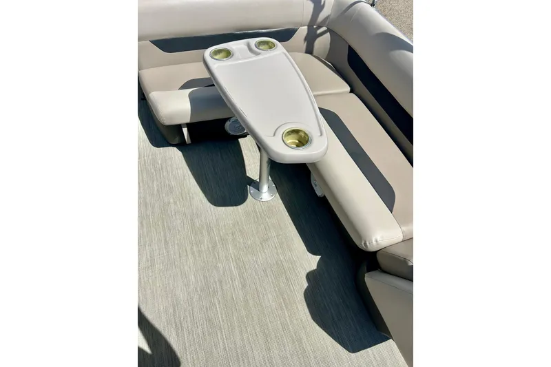 Slide: The Image of 2019 Princecraft Vectra 21 boat interior with beige seating and a central table. - 23