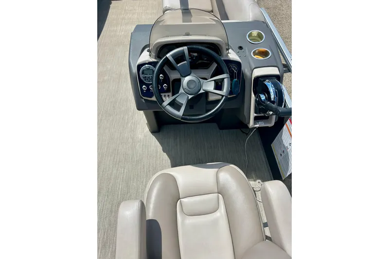 Slide: The Image of 2019 Princecraft Vectra 21 boat dashboard with steering wheel and controls. - 25